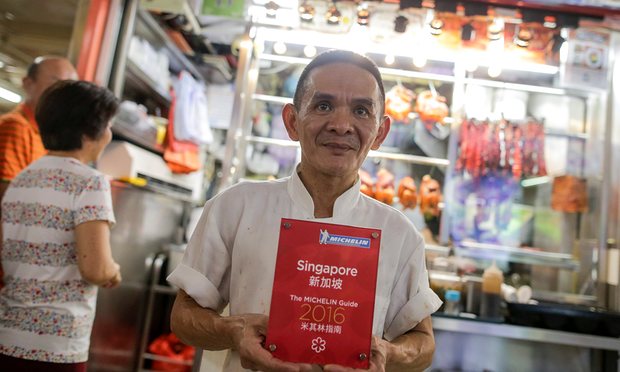 Chan Hon Meng with his Michelin award in front of his store in Singapore. Photograph: Wallace Woon/EPA 